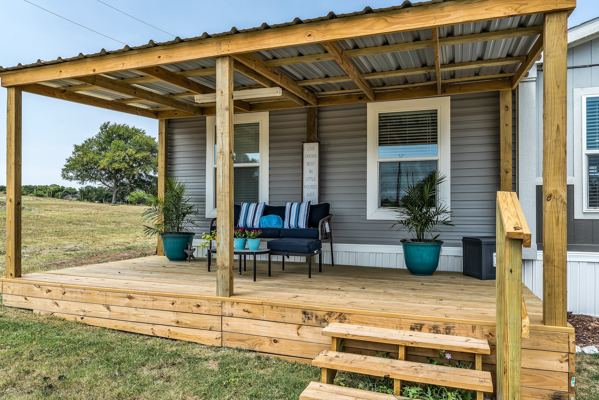 2747 Old Masonic Road Brenham, TX 77833 - Photo 27 of 28 a view of a patio with table and chairs and potted plants