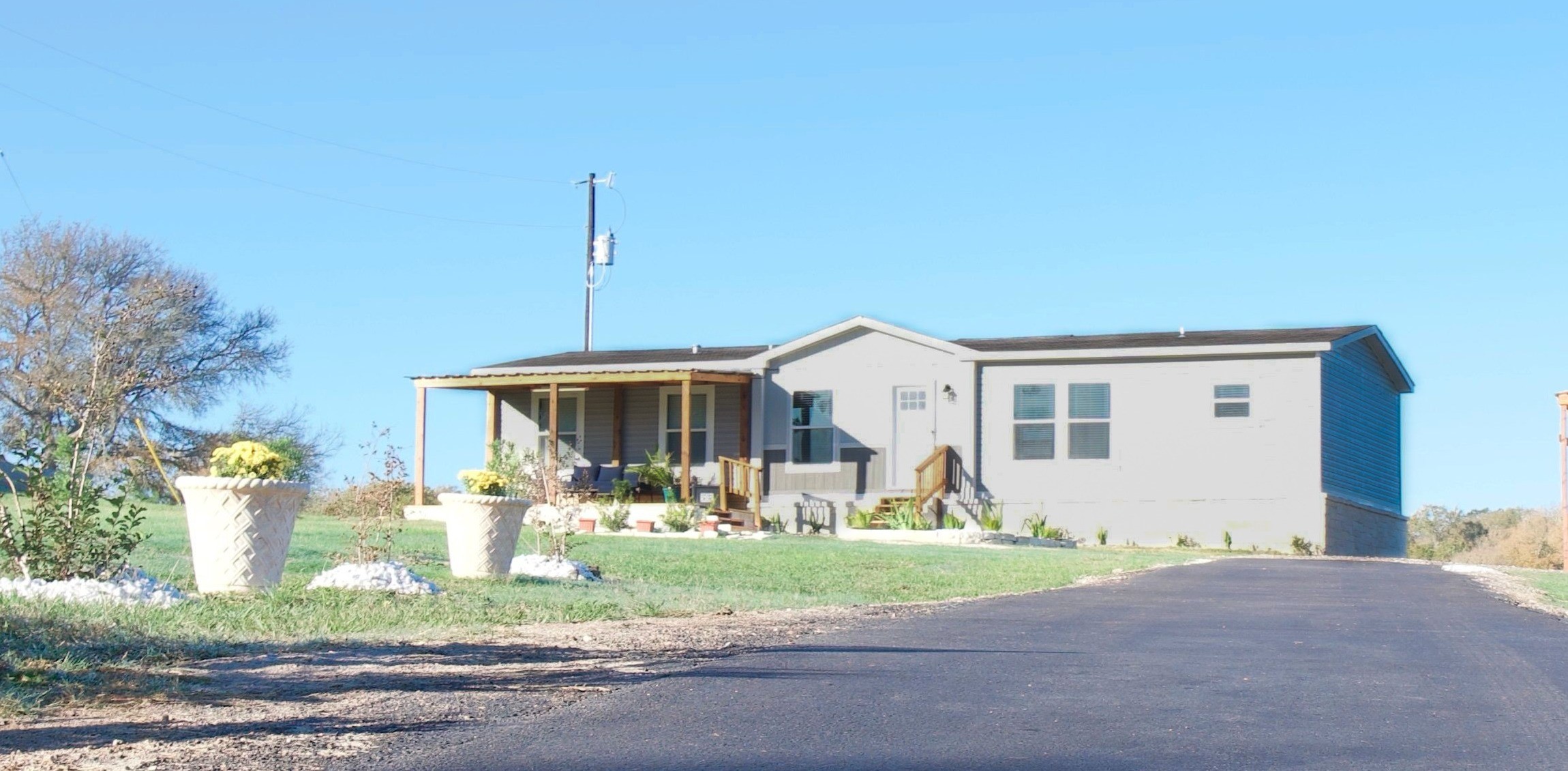 2747 Old Masonic Road Brenham, TX 77833 - Photo 4 of 28 a front view of a house with garden