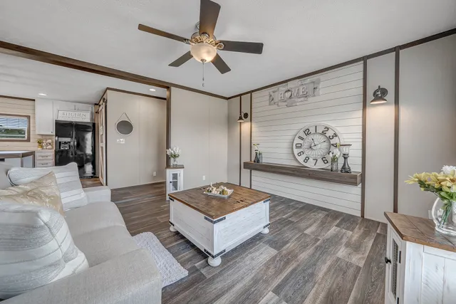 a bathroom with a granite countertop sink a large mirror and a shower
