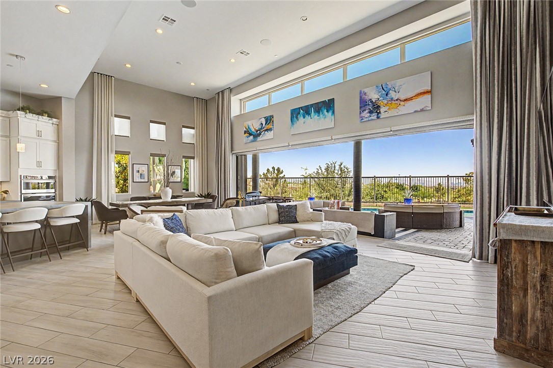 6014 Willow Ridge Court Las Vegas, NV 89135 - Photo 17 of 99 This expansive great room seamlessly blends indoor and outdoor living with high ceilings and abundant natural light.