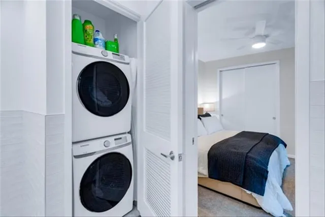 a bedroom with a washer and dryer