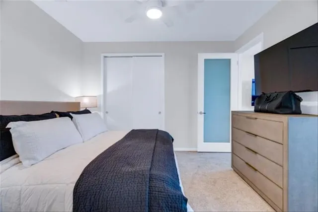 a bedroom with a bed and a flat screen television