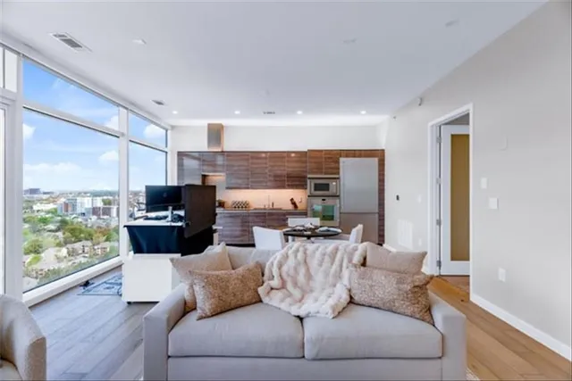 a living room with furniture and a large window