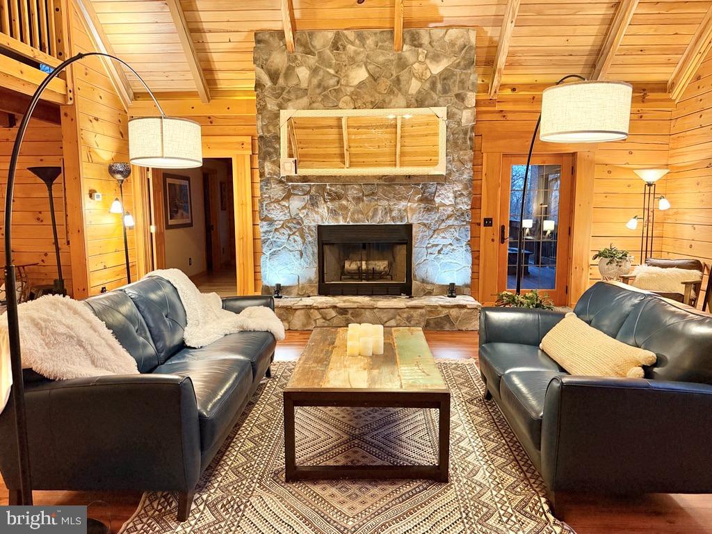 134 Ridgewood Trail Berkeley Springs, WV 25411 - Photo 2 of 7 a living room with furniture and a fireplace