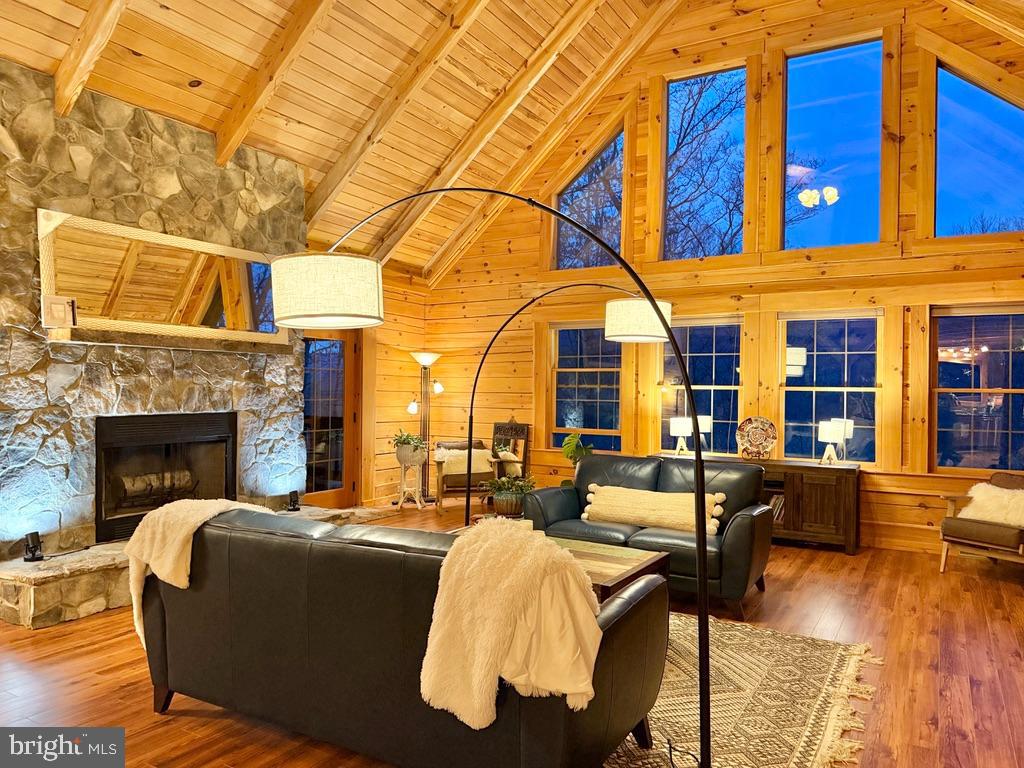 134 Ridgewood Trail Berkeley Springs, WV 25411 - Photo 4 of 7 a living room with furniture fireplace and wooden floor