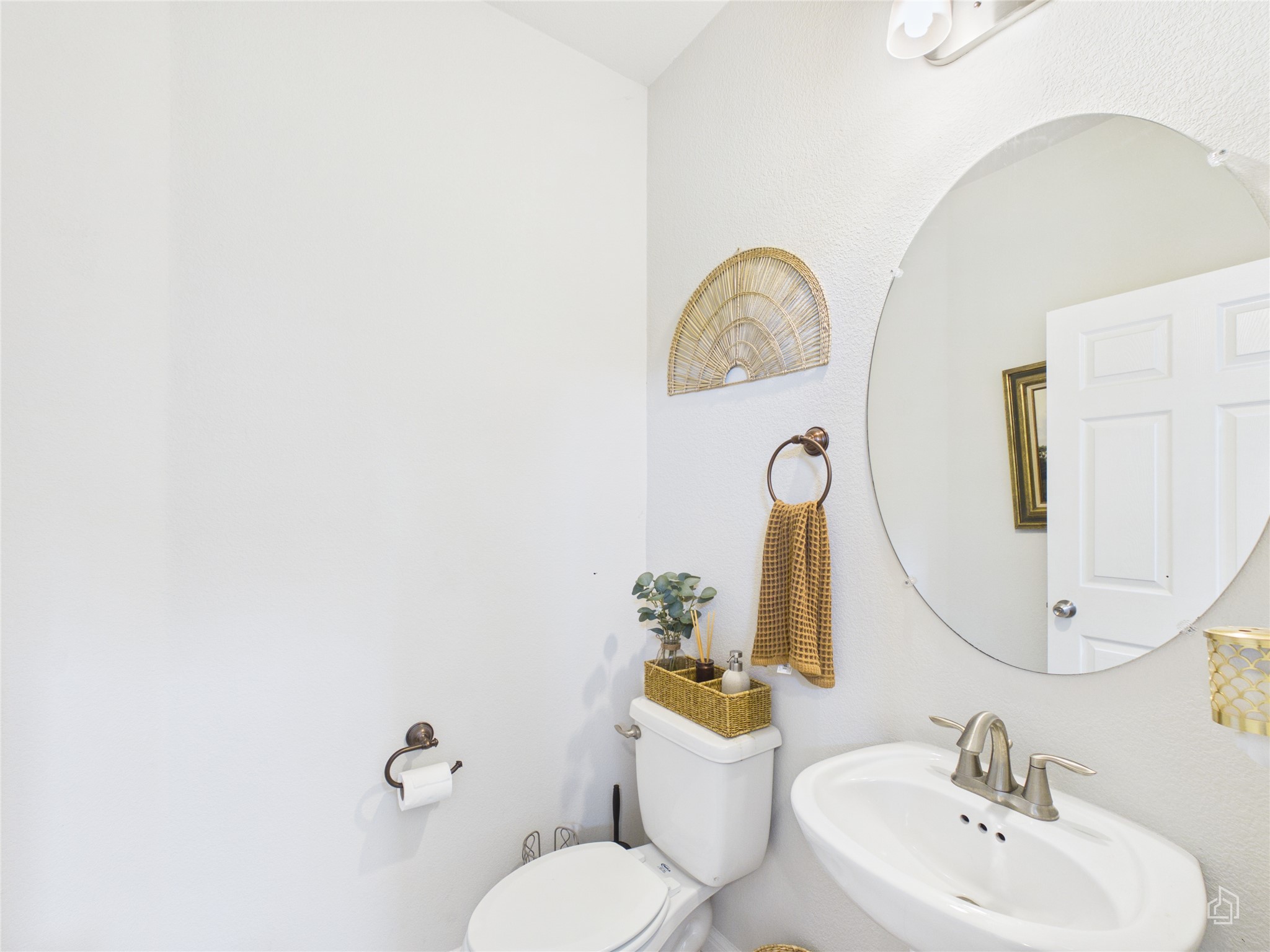 9310 Tanager Way Austin, TX 78748 - Photo 15 of 32 A well-appointed bathroom with a modern sink, sleek mirror, and bright vanity lighting.