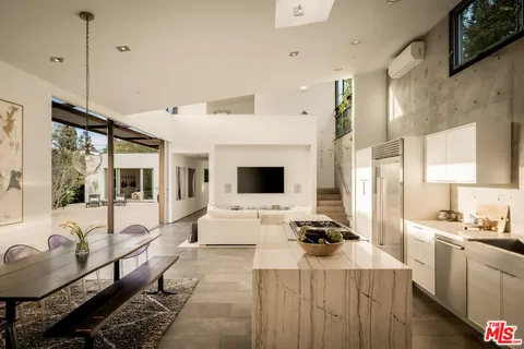 a bathroom with a double vanity sink mirror and shower