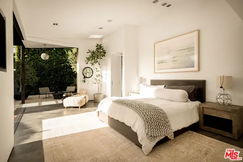 a view of a bench in front of a house