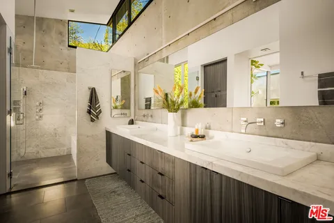 a view of a porch with furniture and front door