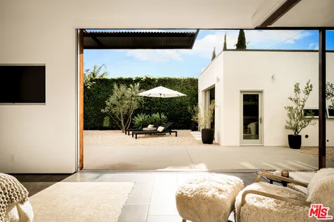 a kitchen with a sink and a large window