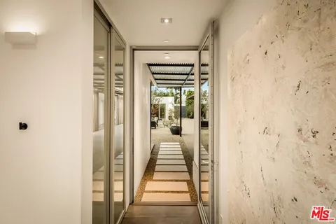 a view of a backyard with sitting area and entertaining space