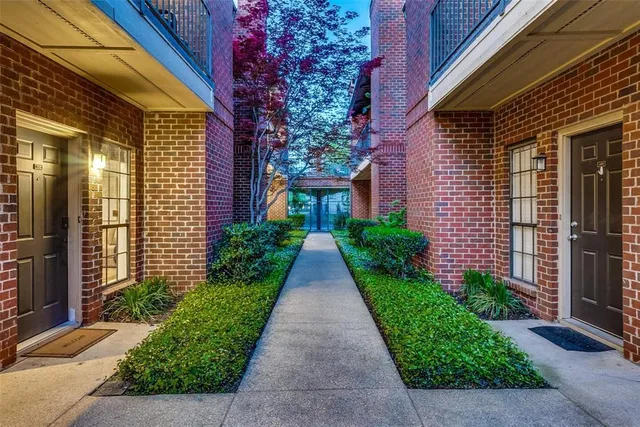 a view of a pathway both side of the house