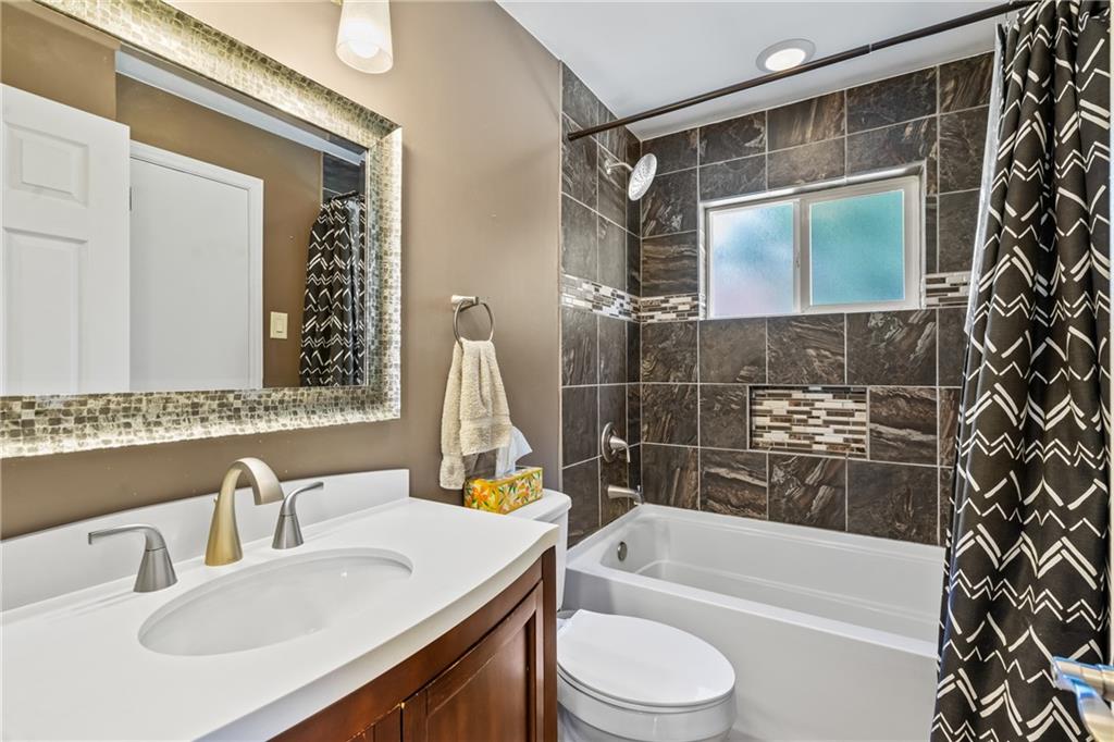 9515 Orchard Road Pittsburgh, PA 15237 - Photo 14 of 28 a bathroom with a sink toilet and shower