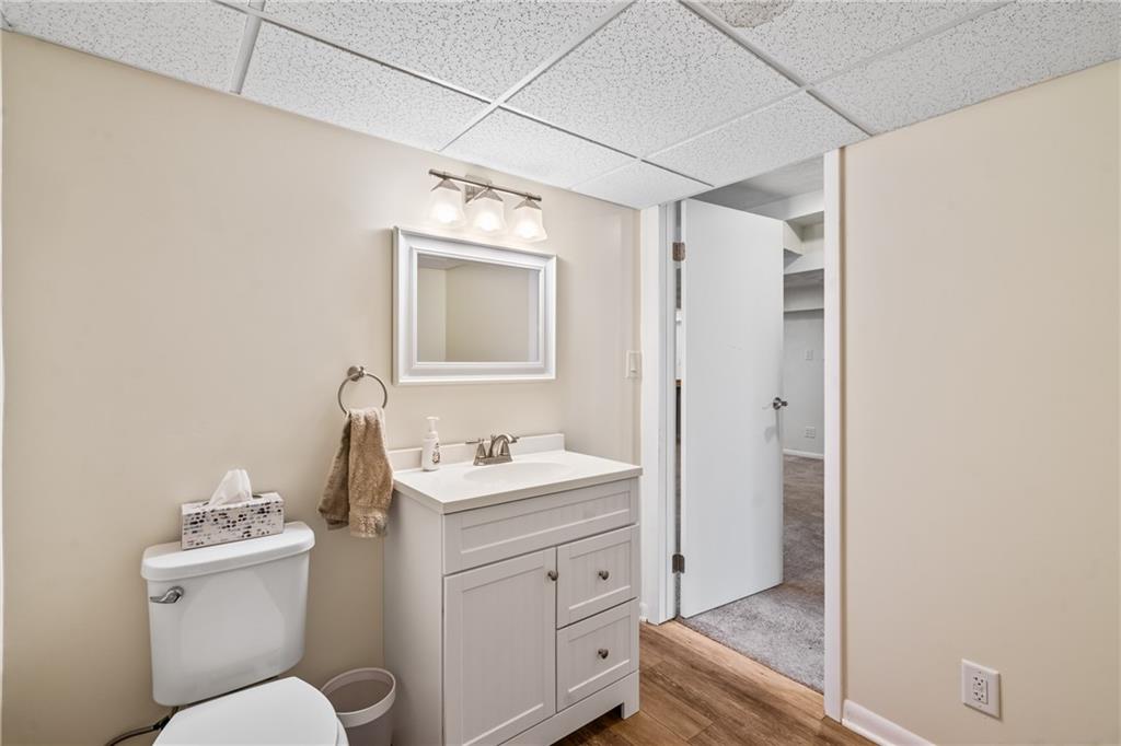 9515 Orchard Road Pittsburgh, PA 15237 - Photo 21 of 28 a bathroom with a toilet sink and mirror