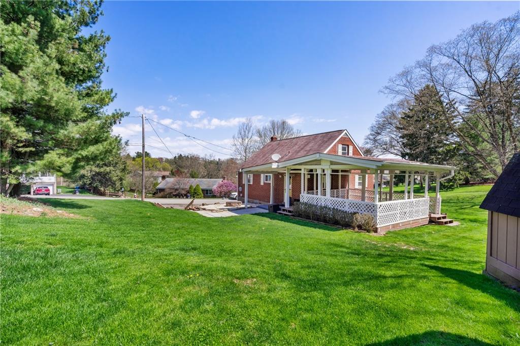 9515 Orchard Road Pittsburgh, PA 15237 - Photo 25 of 28 a front view of a house with garden