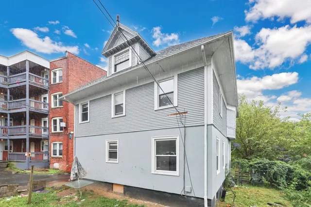 a view of a white building among the street