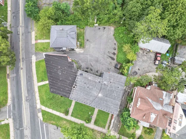 an aerial view of a house with a yard