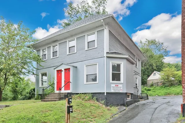 a front view of a house with yard