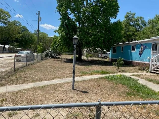 a wooden fence with some trees in the background