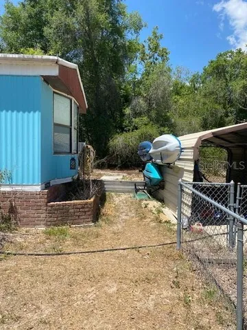 a view of a backyard with sitting area