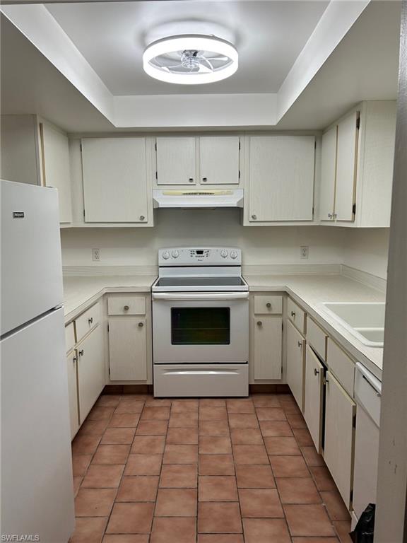 5651 Rattlesnake Hamm Road, Unit C107 Naples, FL 34113 - Photo 8 of 20 KITCHEN AREA LOCATED IN THE FRONT OF THE CONDO