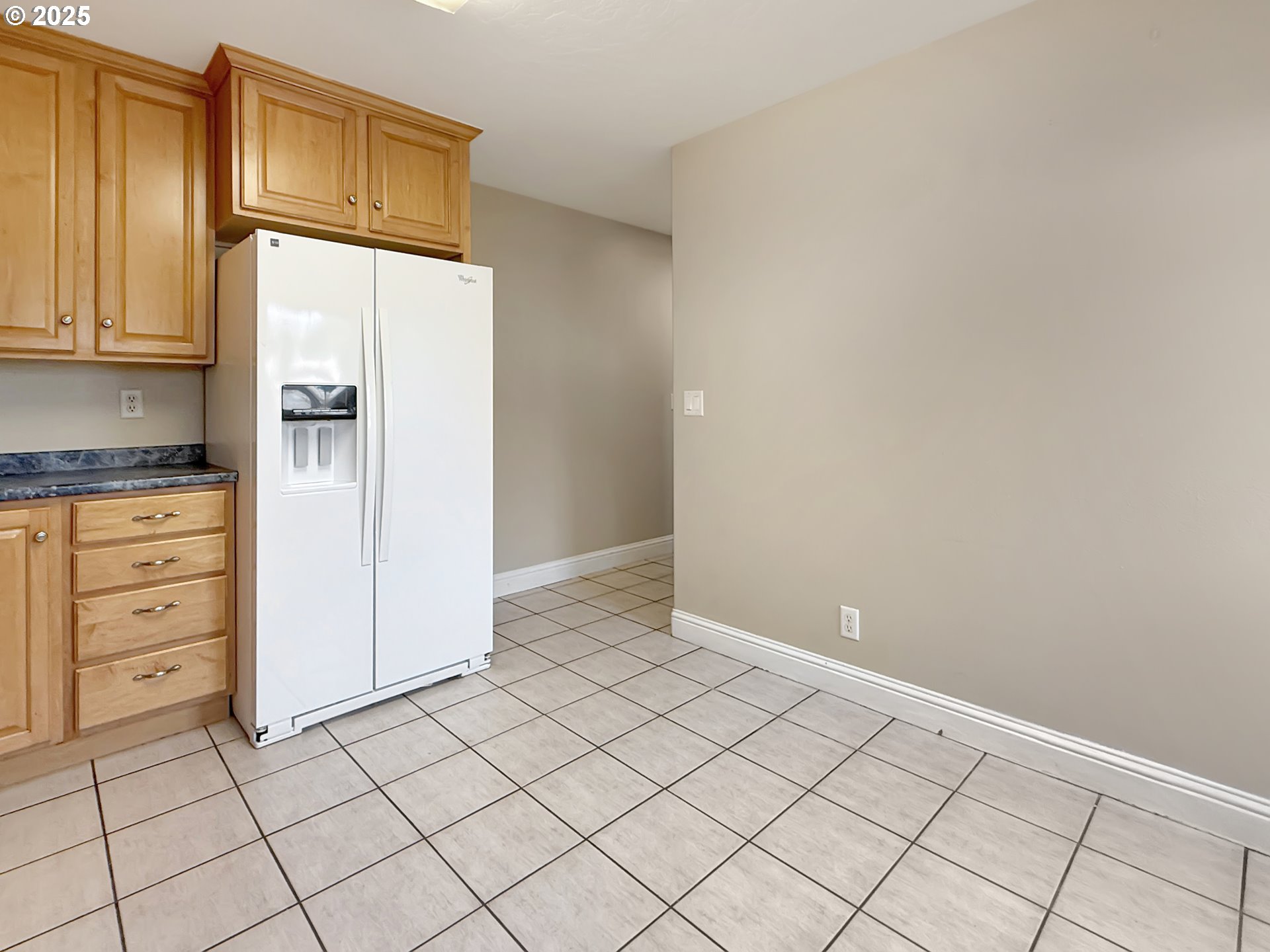 714 Pioneer Road, Unit 1B Brookings, OR 97415 - Photo 13 of 42 a view of cabinets and wooden floor