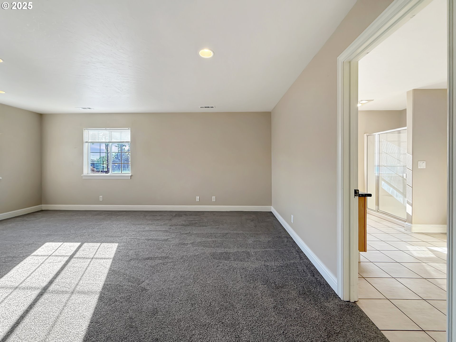 714 Pioneer Road, Unit 1B Brookings, OR 97415 - Photo 18 of 42 an empty room with windows and entrance