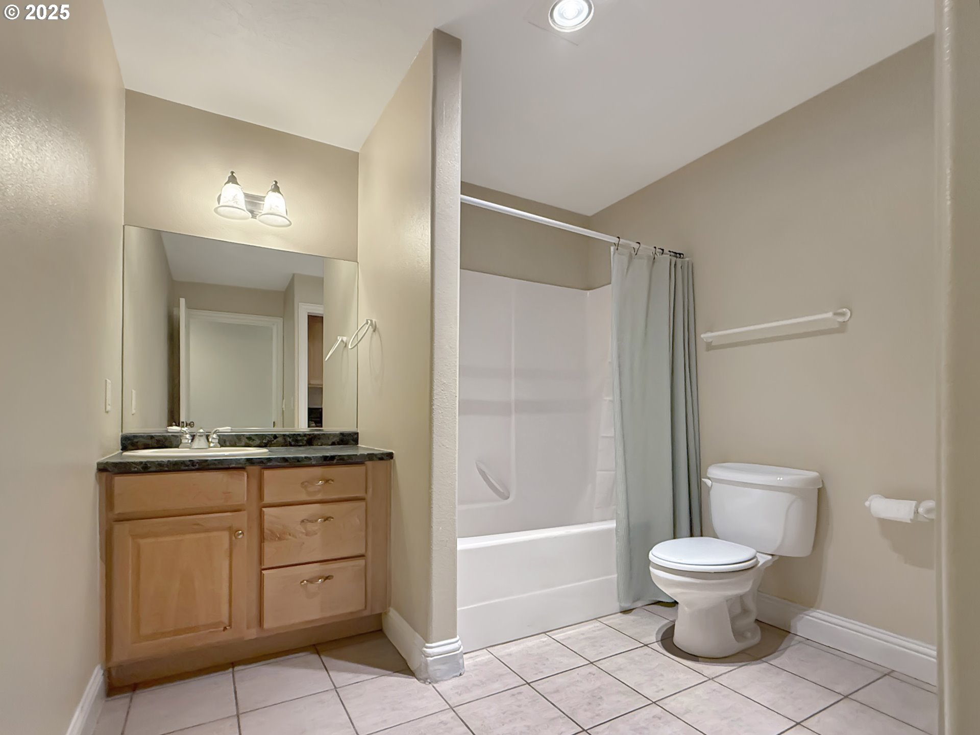 714 Pioneer Road, Unit 1B Brookings, OR 97415 - Photo 29 of 42 a bathroom with a toilet a sink and a mirror