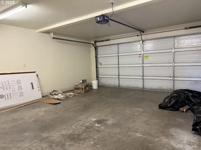 a bed room with a bed and a window