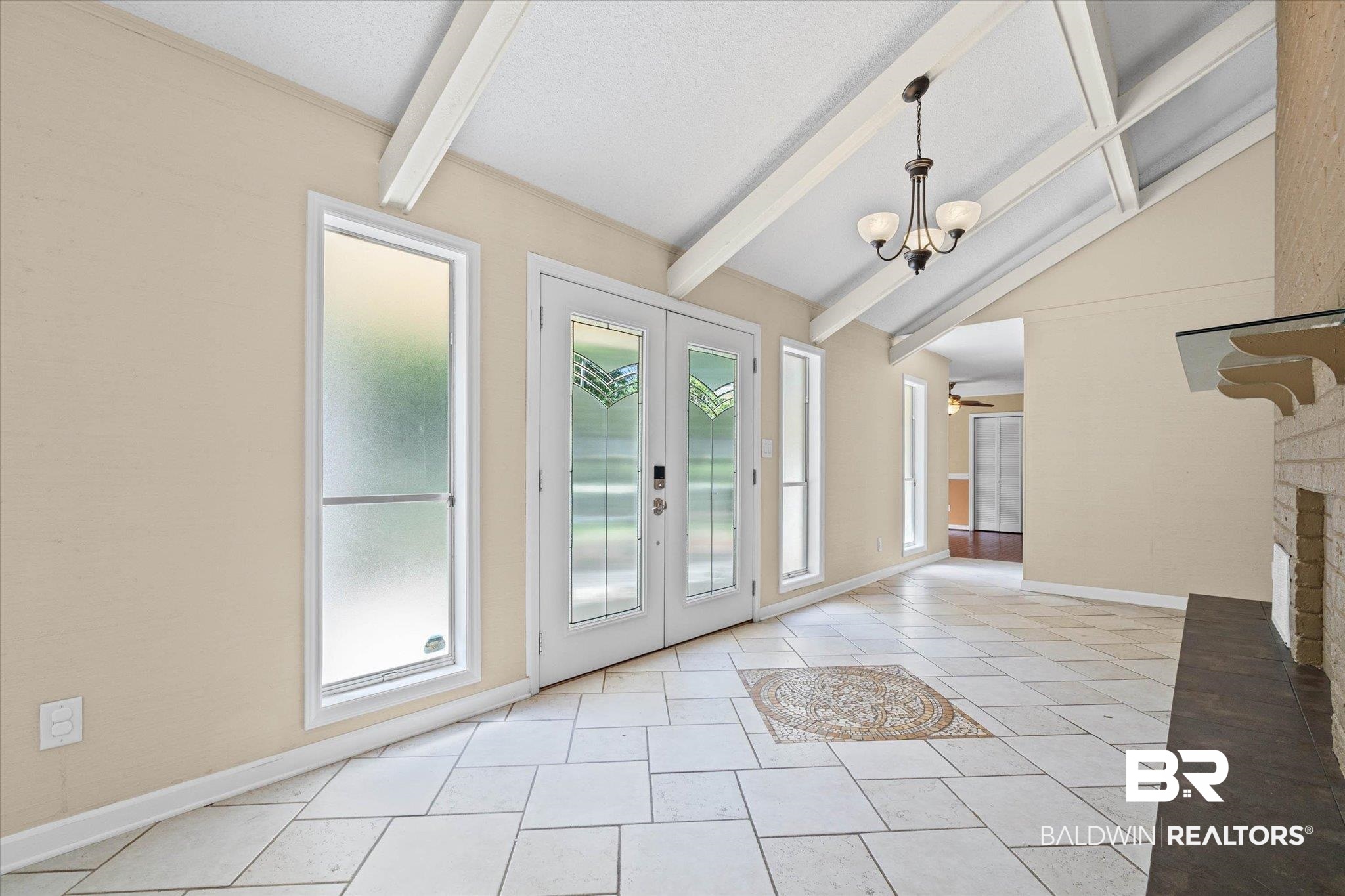 3724 Claridge Road South Mobile, AL 36608 - Photo 6 of 42 Doorway to outside featuring vaulted ceiling with beams, a fireplace, french doors, and ceiling fan