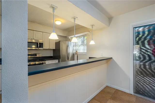 a view of a kitchen with a sink and dishwasher