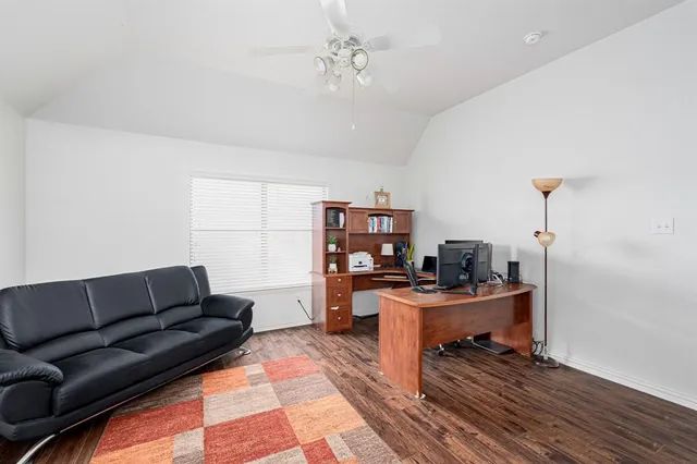a living room with furniture and a rug