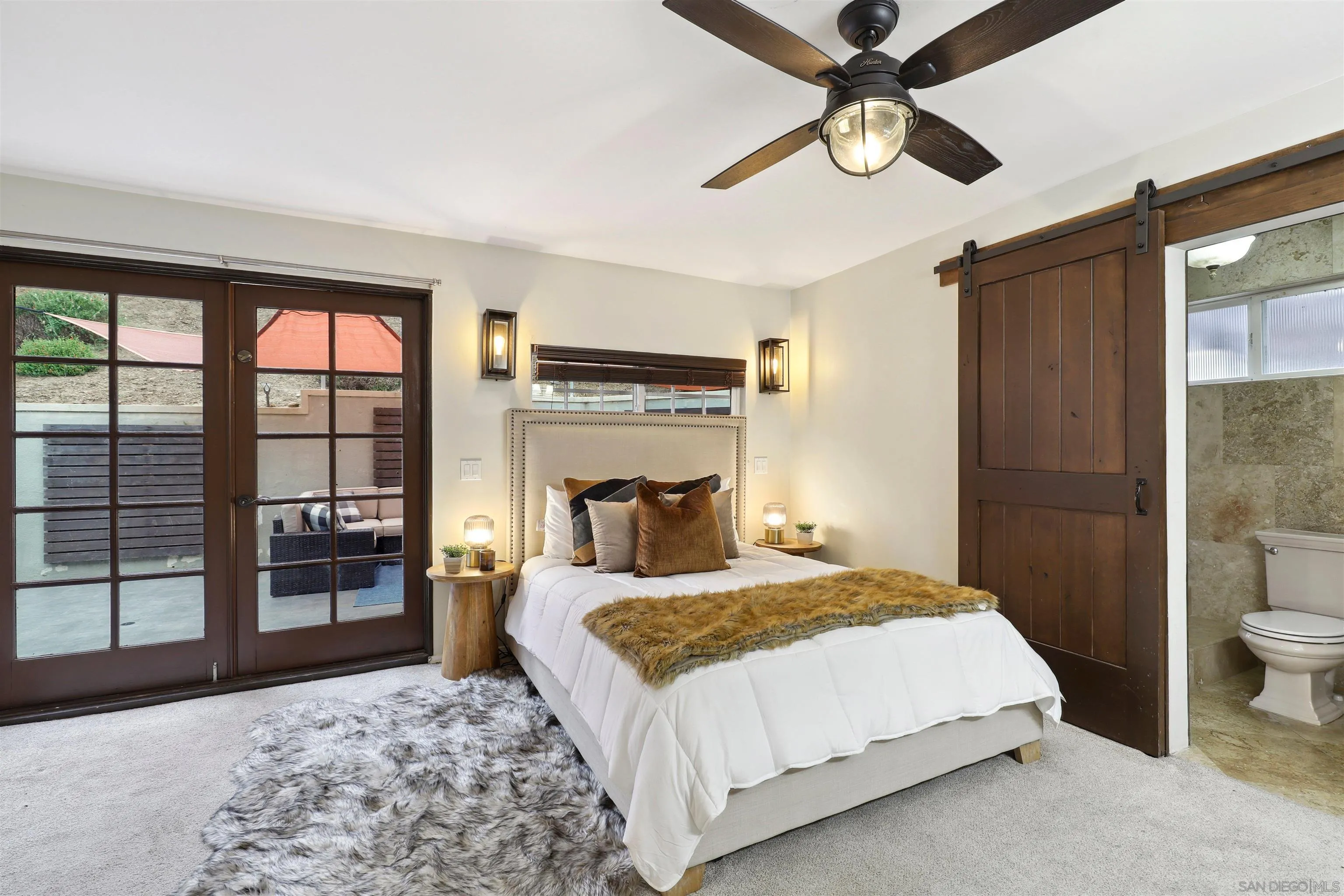 1390 Orpheus Avenue Encinitas, CA 92024 - Photo 15 of 32 a bedroom with a large bed and a window
