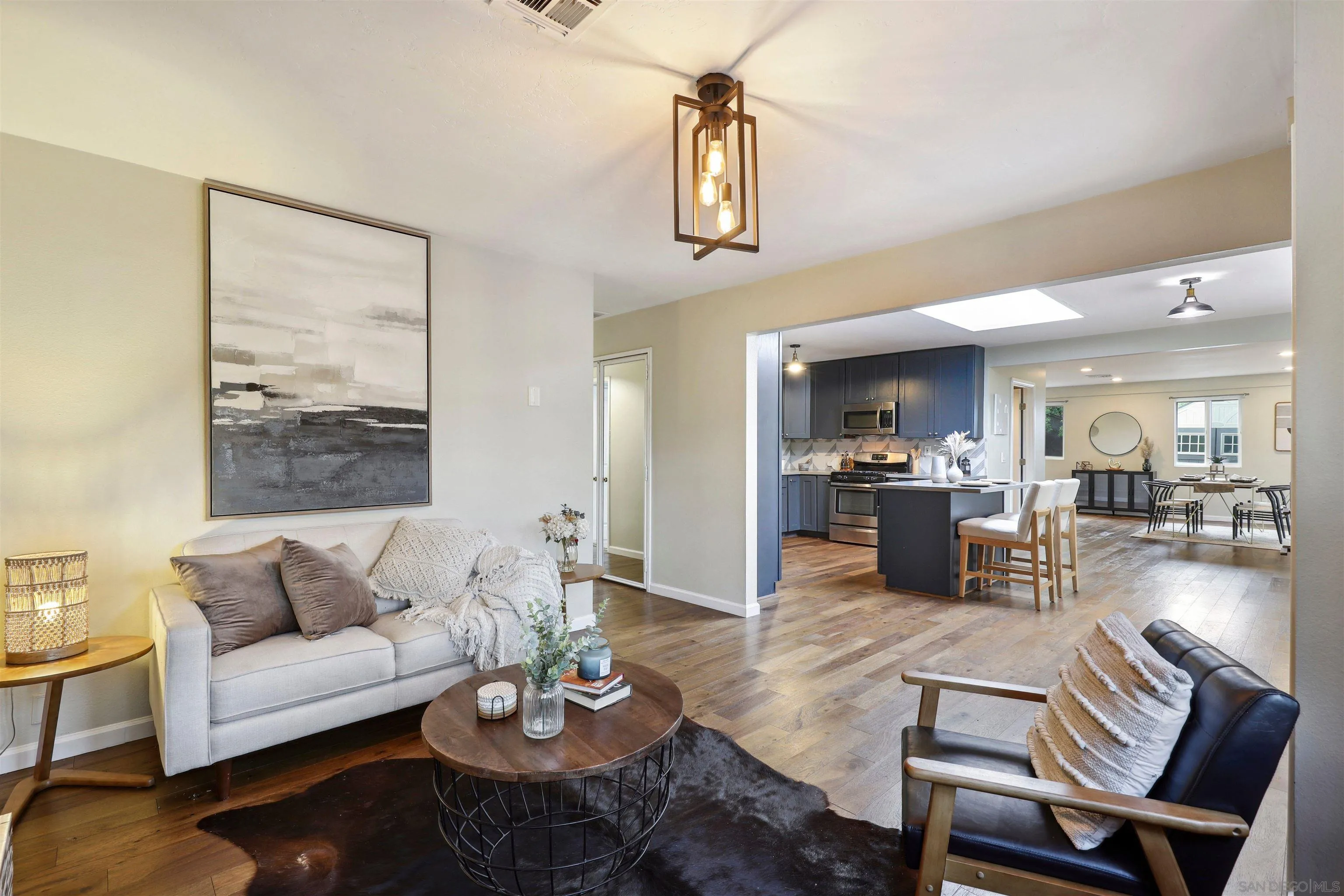 1390 Orpheus Avenue Encinitas, CA 92024 - Photo 6 of 32 a living room with furniture kitchen view and a table