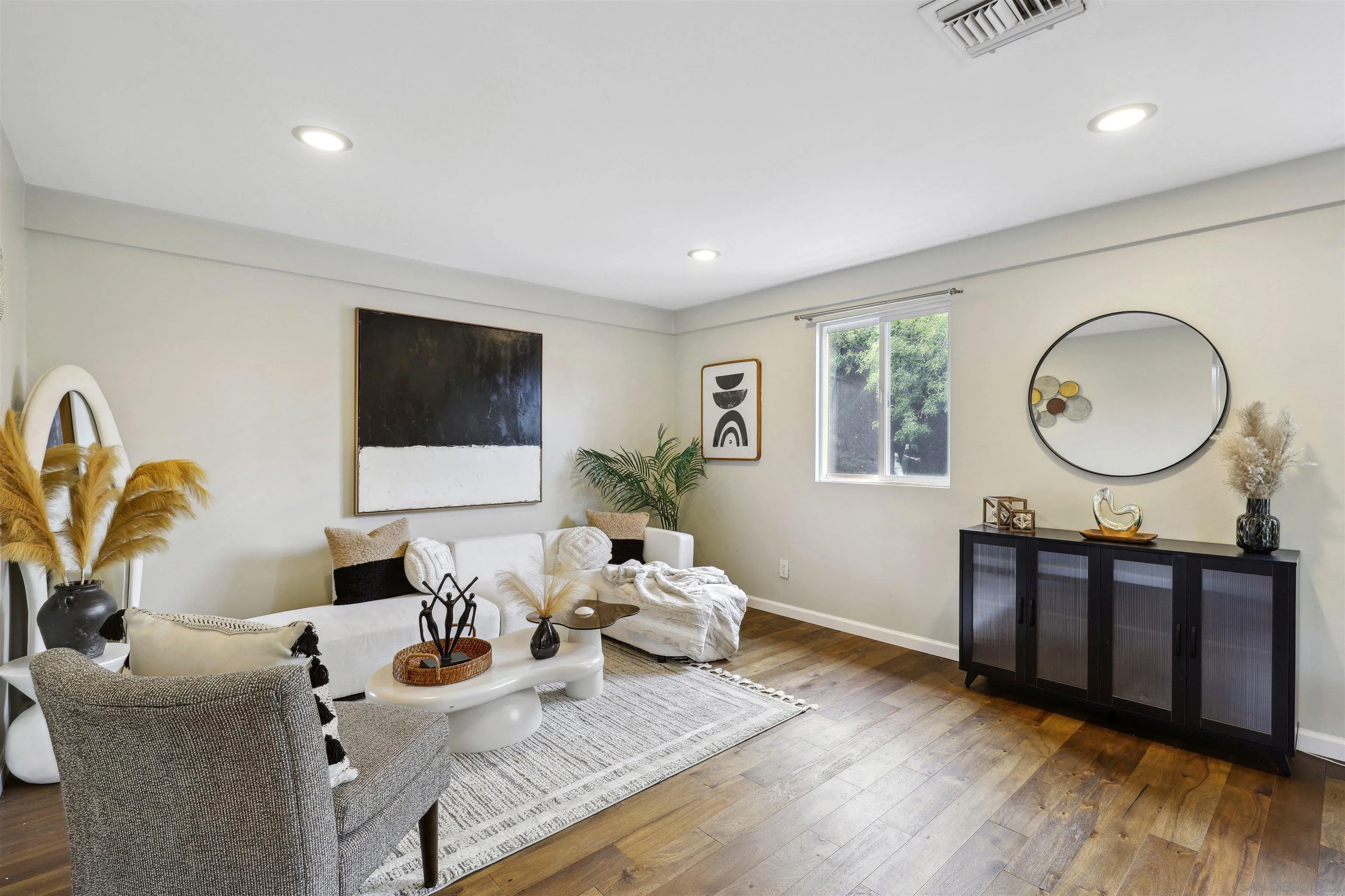 1390 Orpheus Avenue Encinitas, CA 92024 - Photo 8 of 32 a living room with furniture a window and a flat screen tv