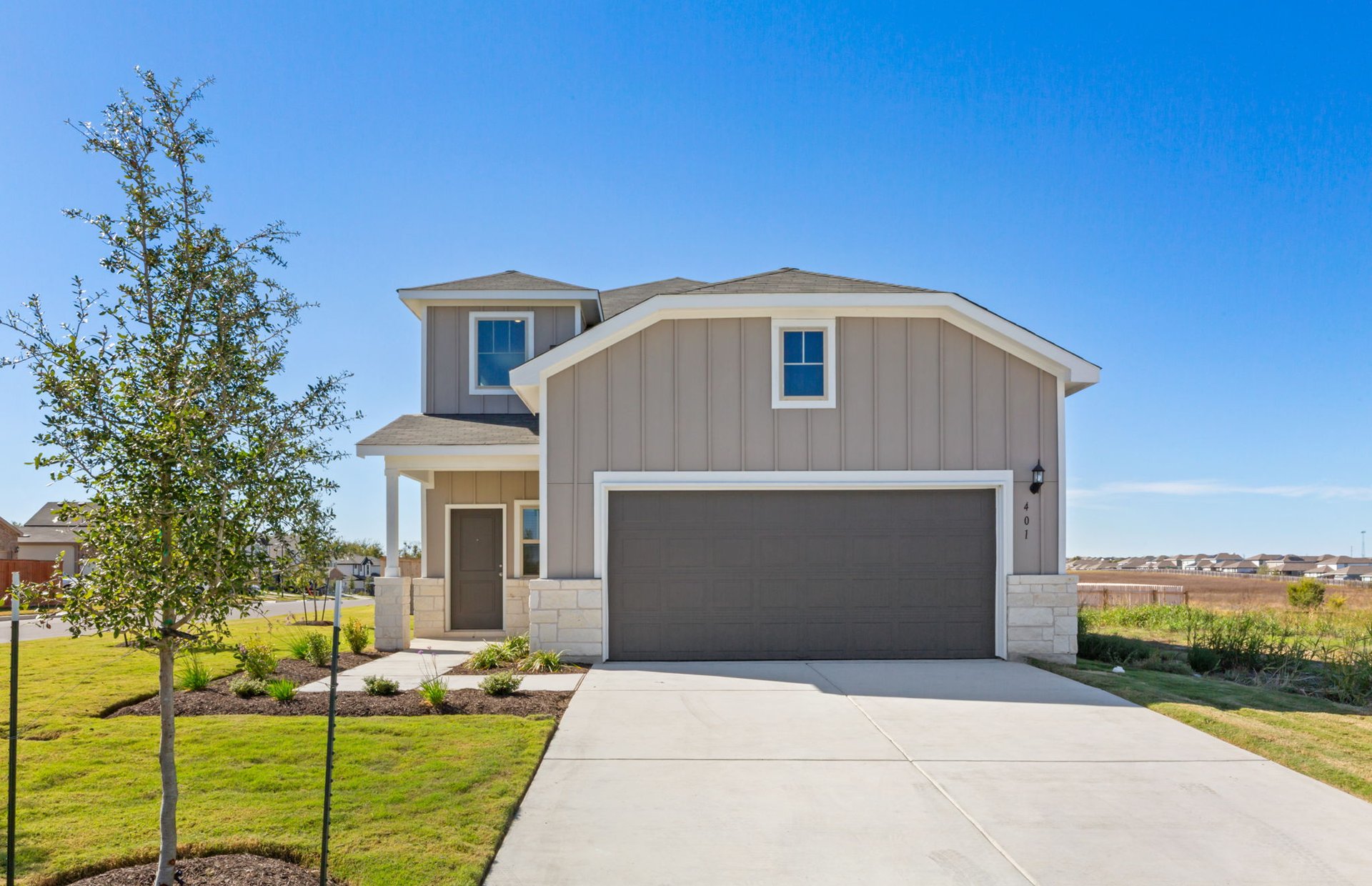 401 The Duke Drive Jarrell, TX 76537 - Photo 1 of 1 a front view of a house with garden