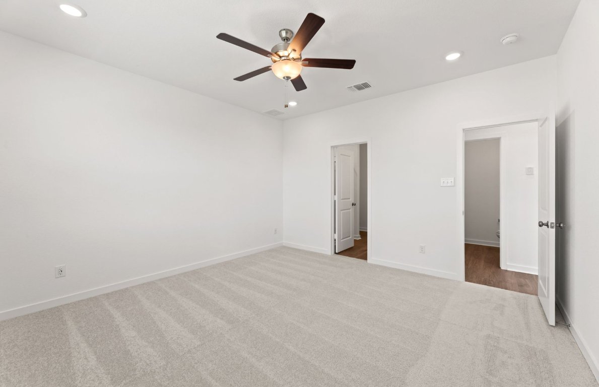 401 The Duke Drive Jarrell, TX 76537 - Photo 10 of 25 an empty room with ceiling fan and window
