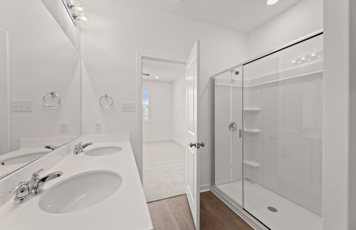 401 The Duke Drive Jarrell, TX 76537 - Photo 11 of 25 a bathroom with a sink and shower