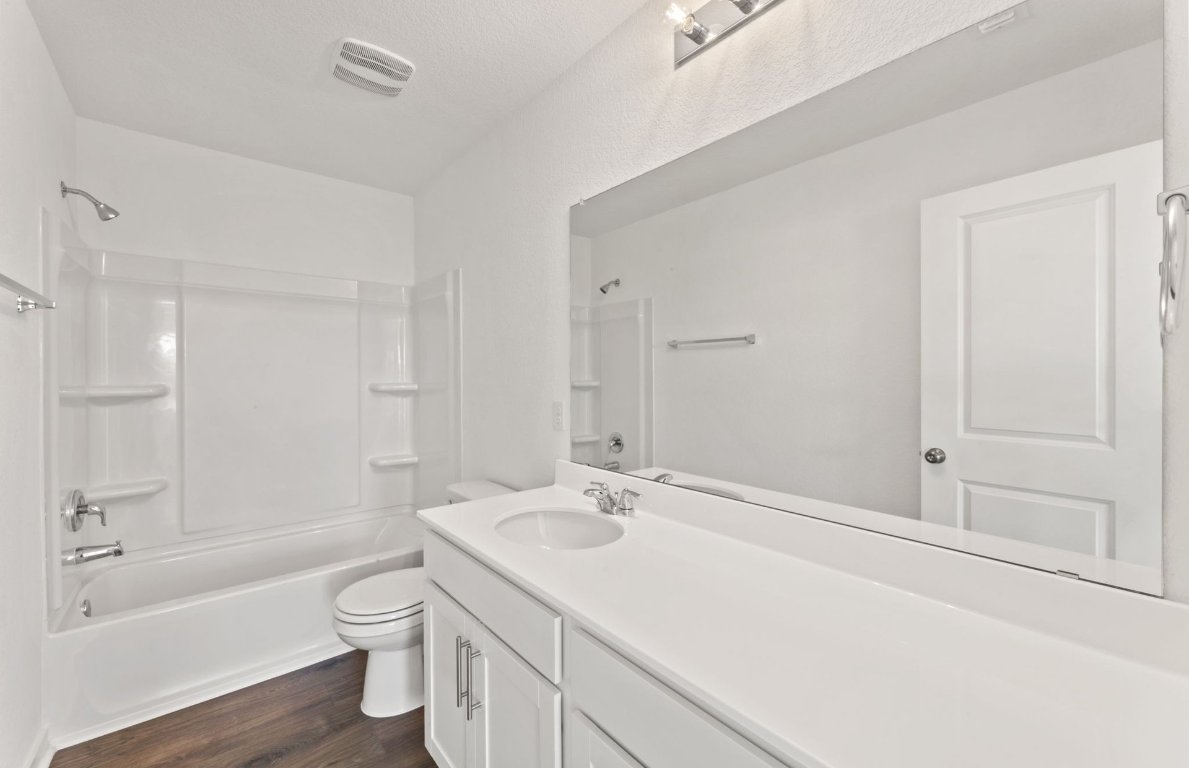 401 The Duke Drive Jarrell, TX 76537 - Photo 17 of 25 a bathroom with a sink a toilet and shower