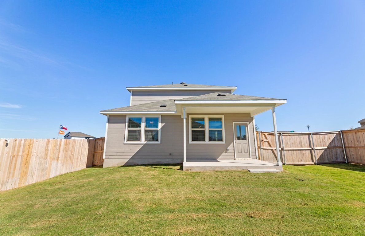 401 The Duke Drive Jarrell, TX 76537 - Photo 21 of 25 a front view of a house with a yard