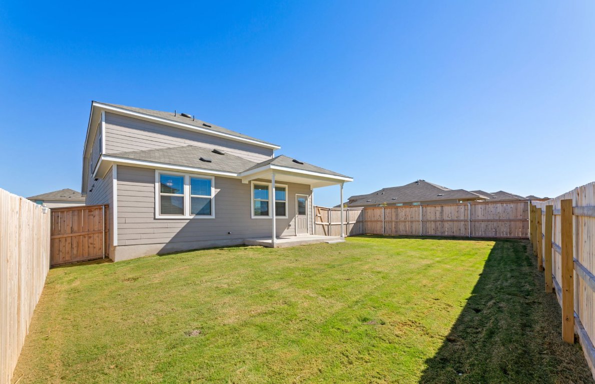 401 The Duke Drive Jarrell, TX 76537 - Photo 23 of 25 a house view with a garden space