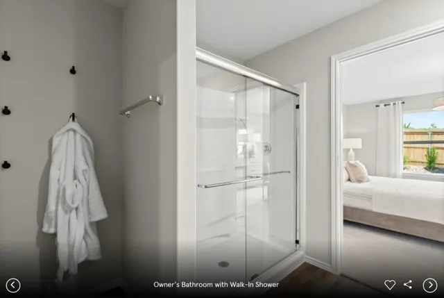 a view of a bedroom with furniture and window