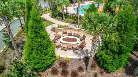 a view of a patio with table and chairs and potted plants