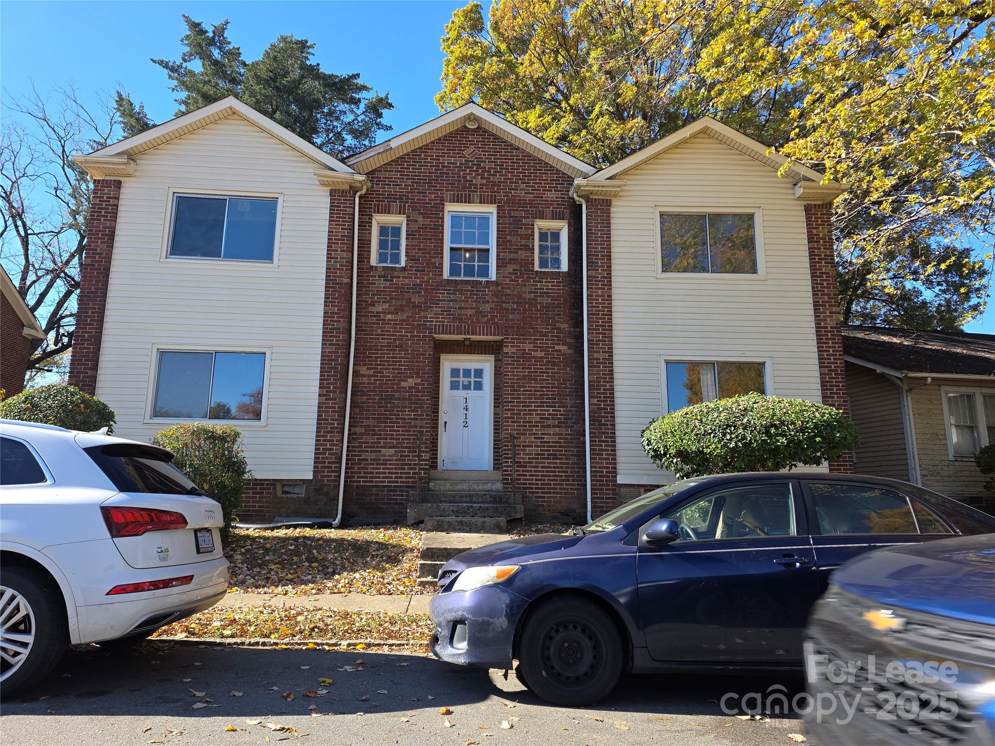 1412 Park Drive, Unit 4 Charlotte, NC 28204 - Photo 1 of 14 a front view of a house with parking space