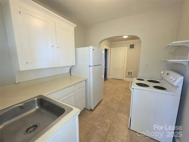 a utility room with a sink a washer and dryer
