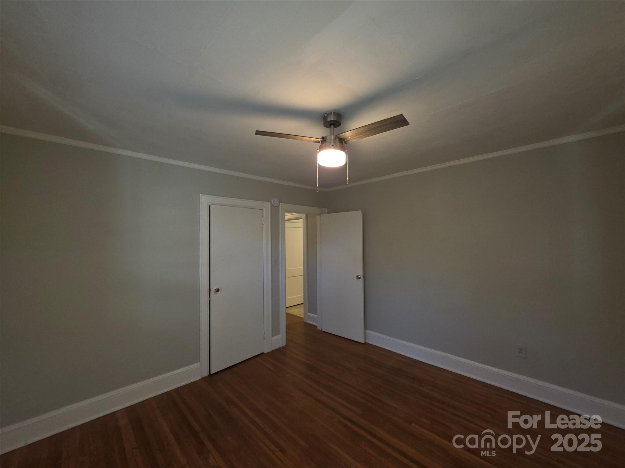 1412 Park Drive, Unit 4 Charlotte, NC 28204 - Photo 10 of 14 an empty room with wooden floor and windows
