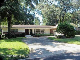 920 Waterman Road South Jacksonville, FL 32207 - Photo 1 of 1 a front view of a house with a yard and garage