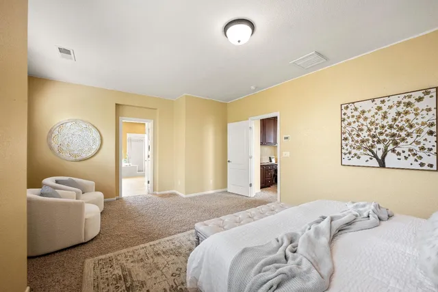 a bedroom with bed and a window