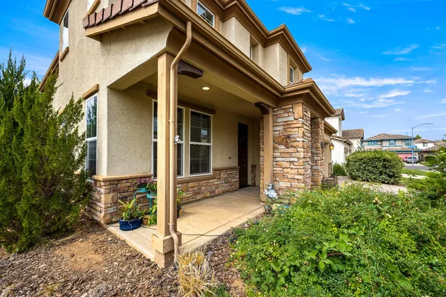 front view of a house with a small yard