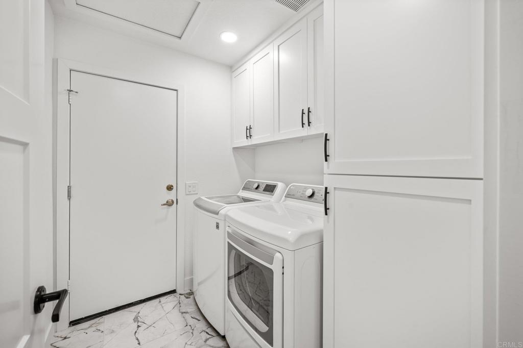 29086 Laurel Valley Drive Vista, CA 92084 - Photo 23 of 39 a utility room with dryer and washer